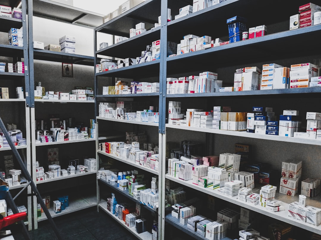 Rows of organized medicine shelves inside our pharmacy